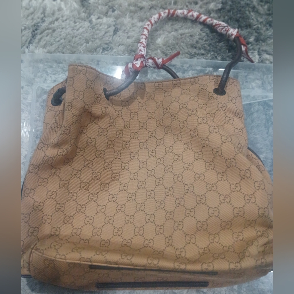 Gucci Tan Monogram Drawstring Shoulder Bag with Red-Accent Handle Wrap